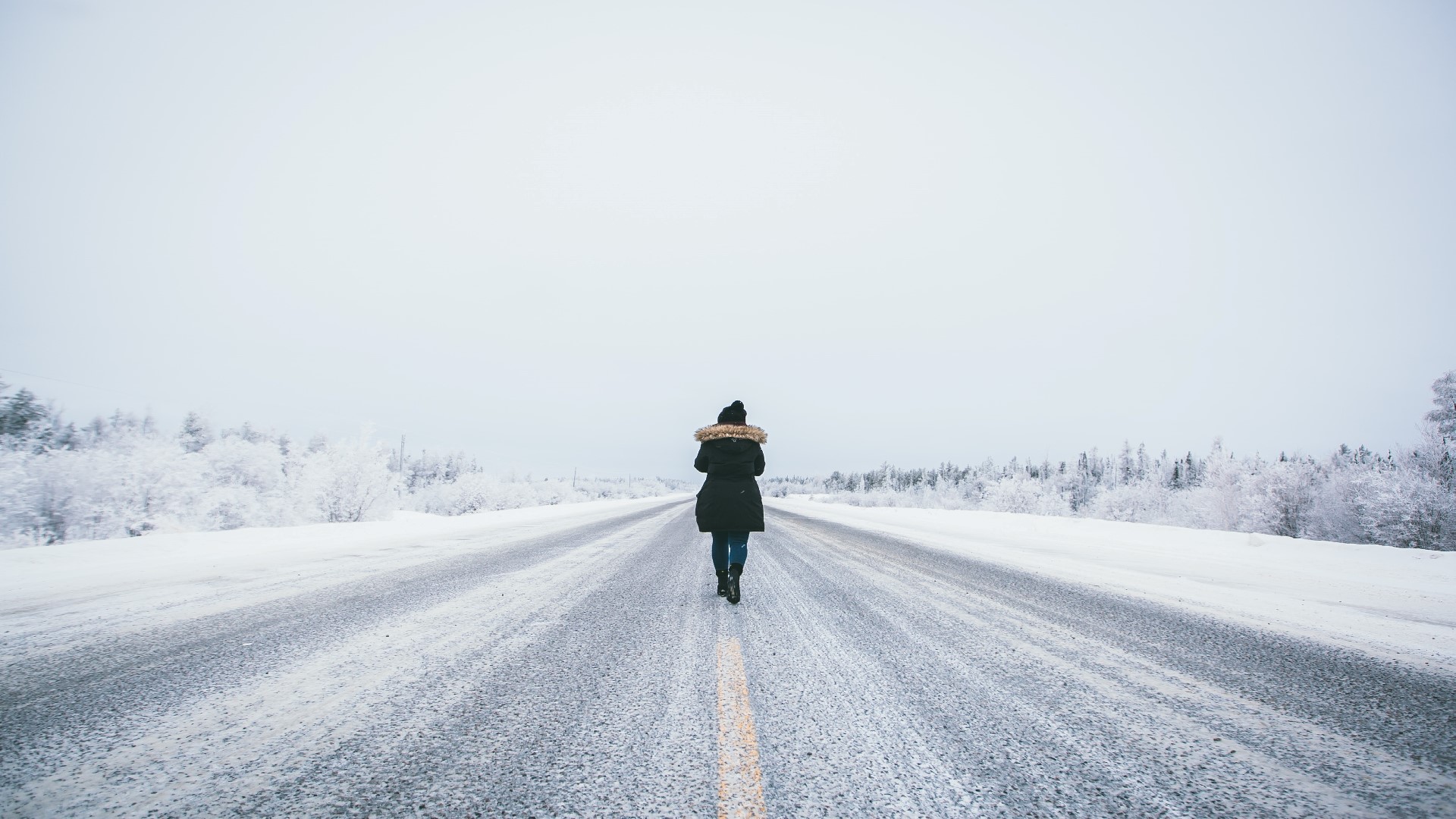 An image of a person walking a road 