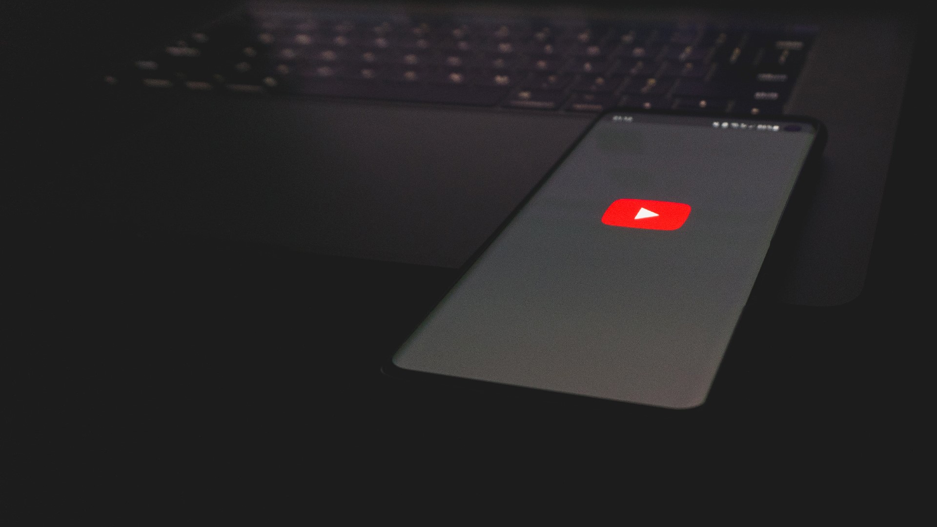 An image of a mobile phone with a Youtube logo