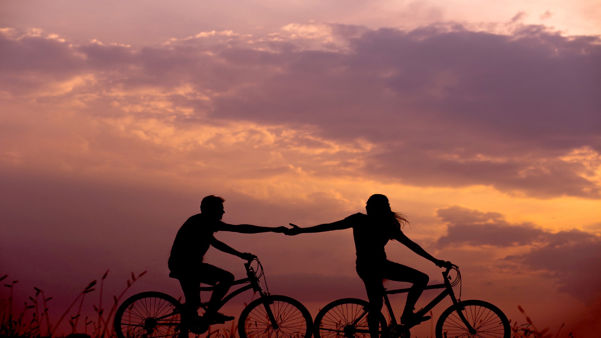 An image of a couple cycling