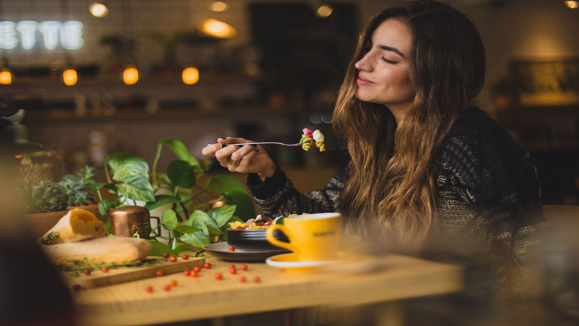 An image of a woman eating food 