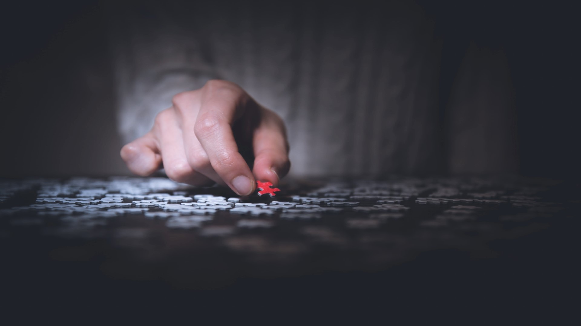 An image of a person solving a puzzle