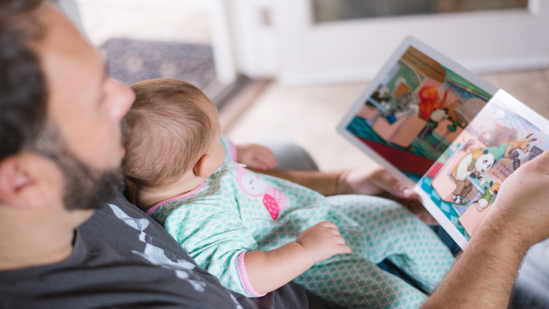 An image of a pesron holding a baby