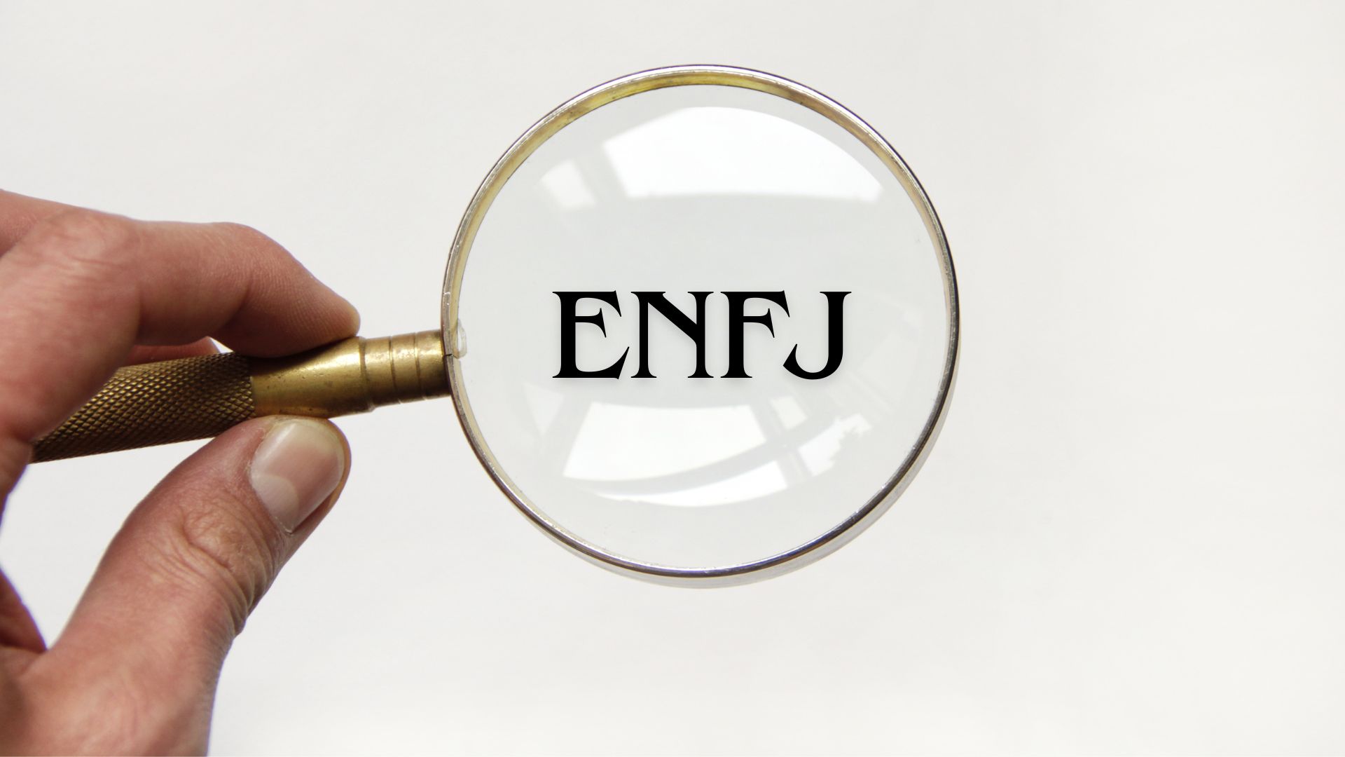 A magnifying glass showing how to spot an ENFJ