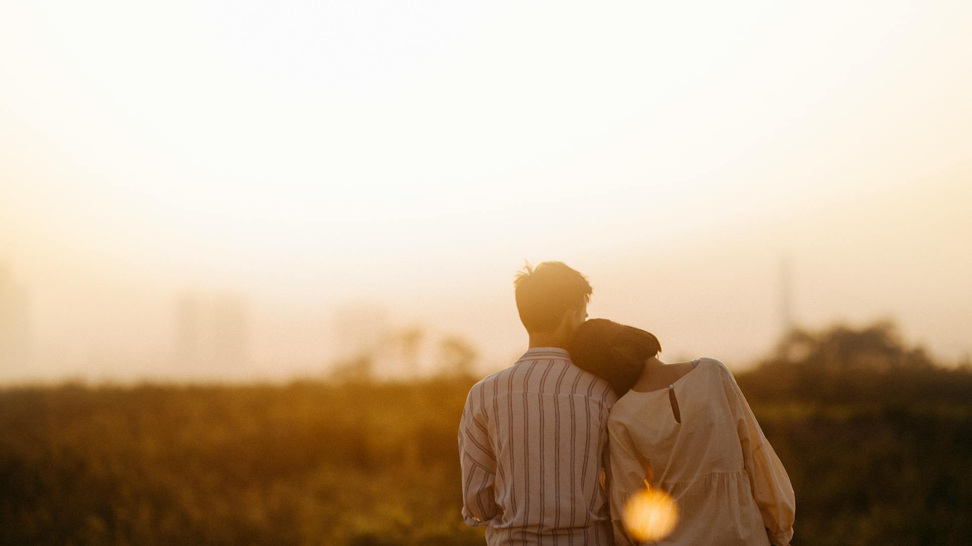 a girl leaning on a boy