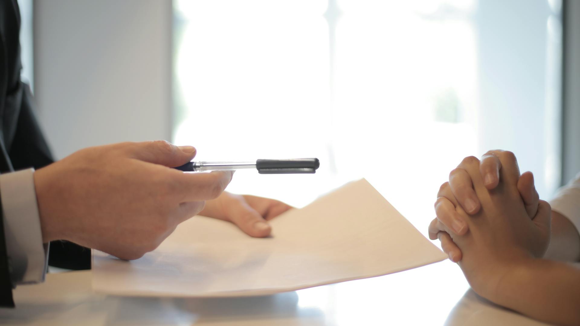 a person holding a pen